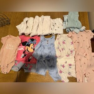 Bundle of newborn baby girl clothes